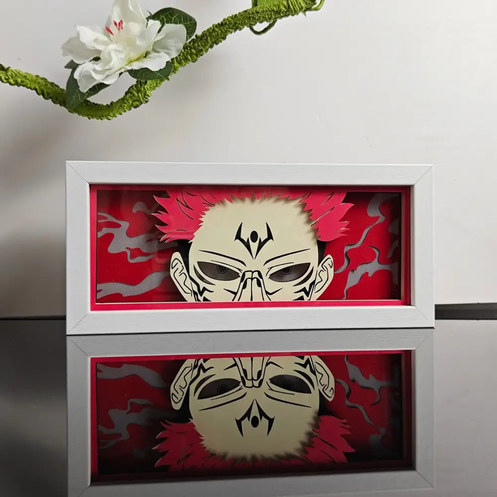 White-framed anime paper-cut led lamp with red spiky hair design and remote control for paper-cut led night use