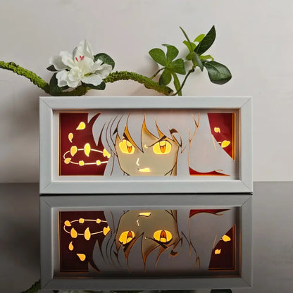 Anime paper-cut led light box with white frame silver hair and glowing yellow eyes against red background with 7-color remote