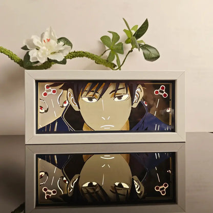 White-framed anime paper-cut led light box with 7-color remote featuring dark-haired character with intense eyes and glowing background