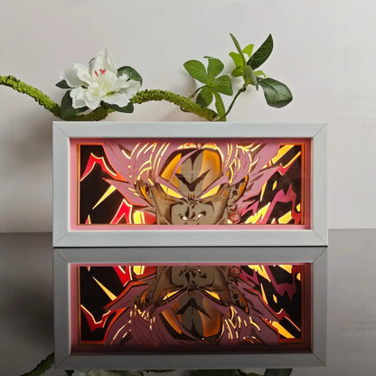 White-framed anime paper-cut led light box with 7-color remote and glowing orange red energy effects