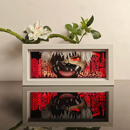 White-framed anime paper-cut LED light box with 7-color remote featuring glowing red eyes and red digital cityscape