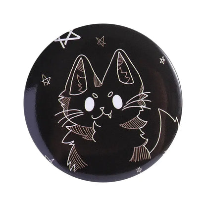 Black circular anime pin brooch featuring a white cat line-art on durable tinplate with pin backing and star motifs