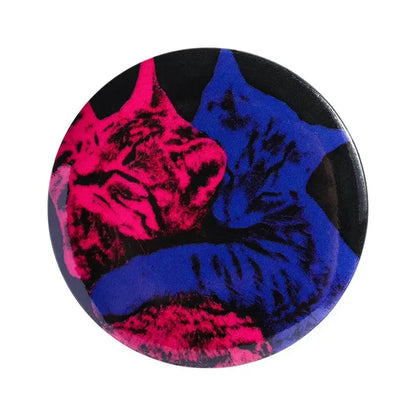 Anime pin brooch featuring vibrant pink and deep blue cats on a durable tinplate with pin backing and glossy finish