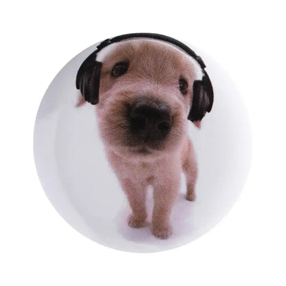 White circular anime pin brooch made of durable tinplate featuring a light brown puppy with black headphones and pin backing
