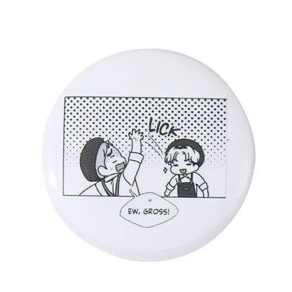 White circular anime pin brooch featuring a black and white comic panel made of durable tinplate with pin backing