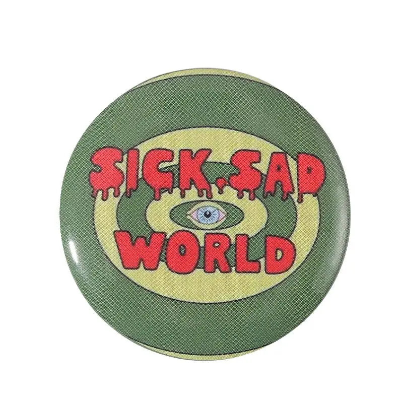 Olive green anime pin brooch with bold red text and blue eye design on durable tinplate with pin backing