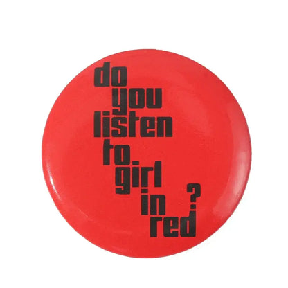 Red circular anime pin brooch with black text on durable tinplate and secure pin backing reading do you listen to girl in red