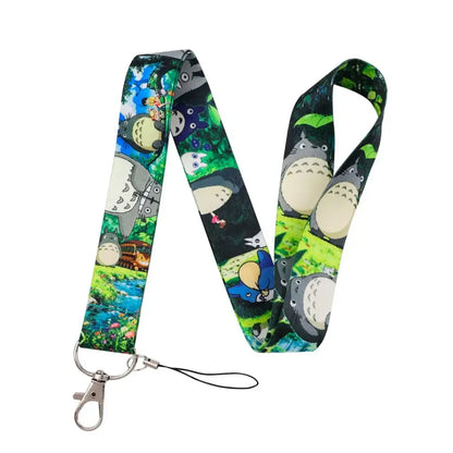 Colorful totoro-themed neck strap lanyard with vibrant forest print on fabric and silver metal clasp for id cards
