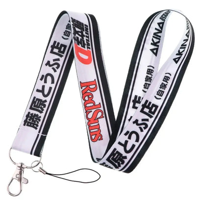 White and black neck strap lanyard with red redsun logo japanese text and silver metal clasp for id card holder