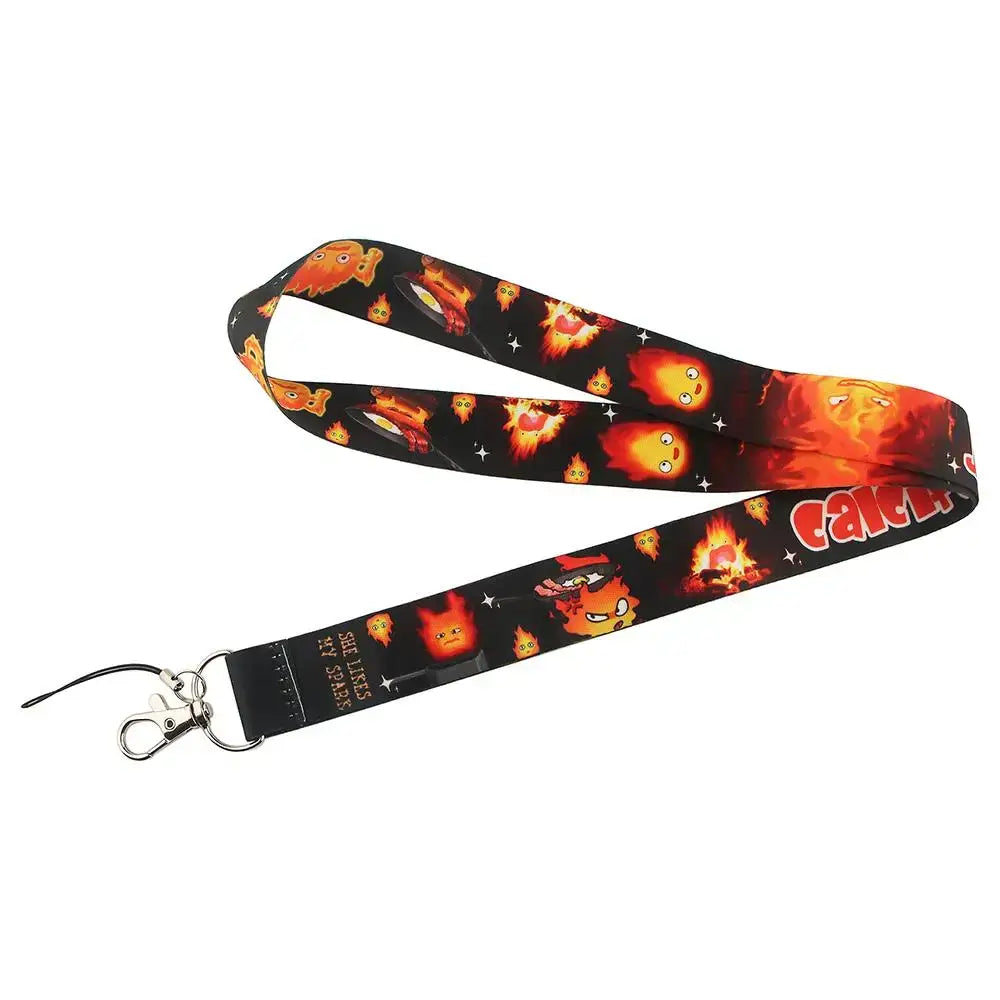 Black neck strap lanyard with cartoon flame creatures and red catch text featuring a silver metal clasp for ID cards