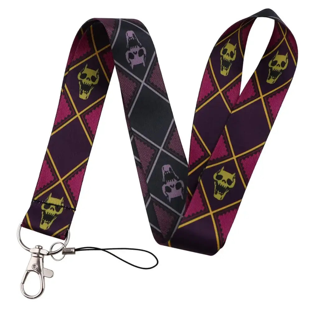 Purple and black argyle-patterned neck strap lanyard with yellow and pink skulls and silver metal clasp for id cards