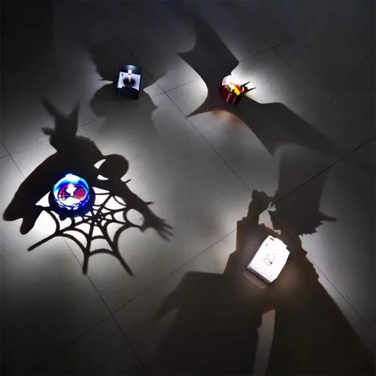 Anime shadow projector lamp with glowing blue and red light casting a spiderweb shadow on the floor for night use