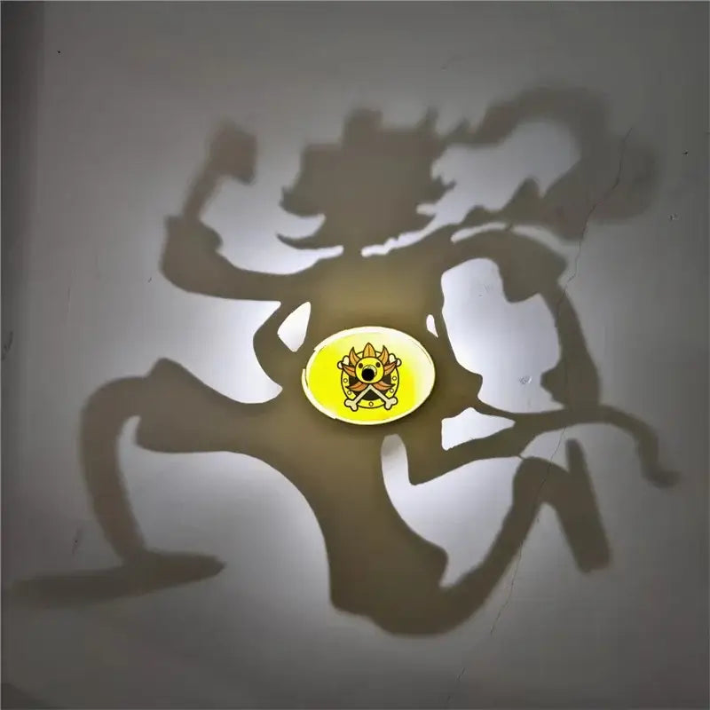 Yellow circular anime shadow projector lamp with cartoon crown skull design casting an animated kaito kid shadow