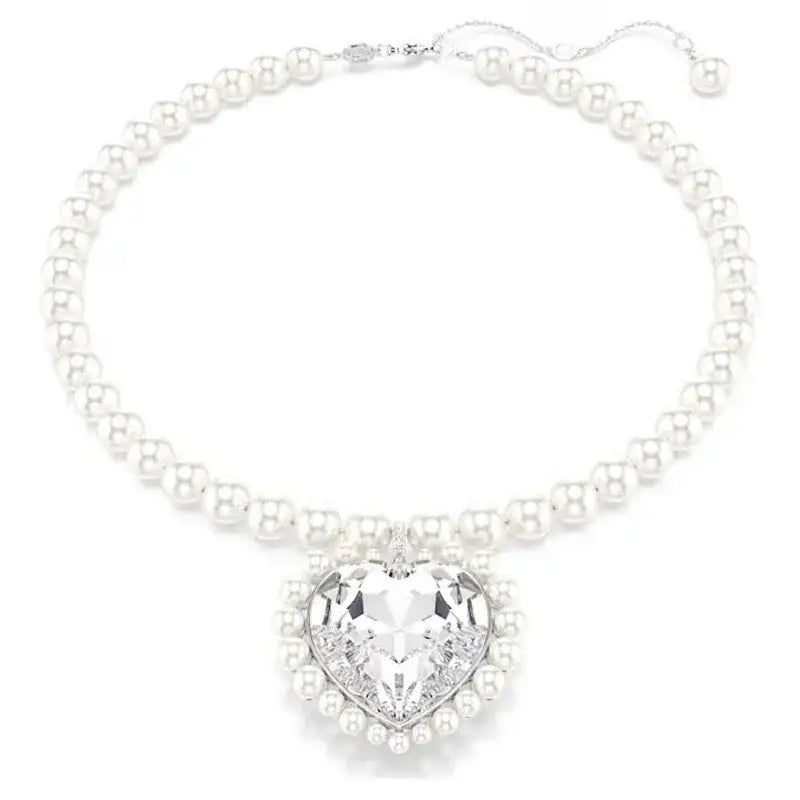 Elegant anime tennis necklace in sterling silver featuring a pearl design with a heart-shaped crystal pendant