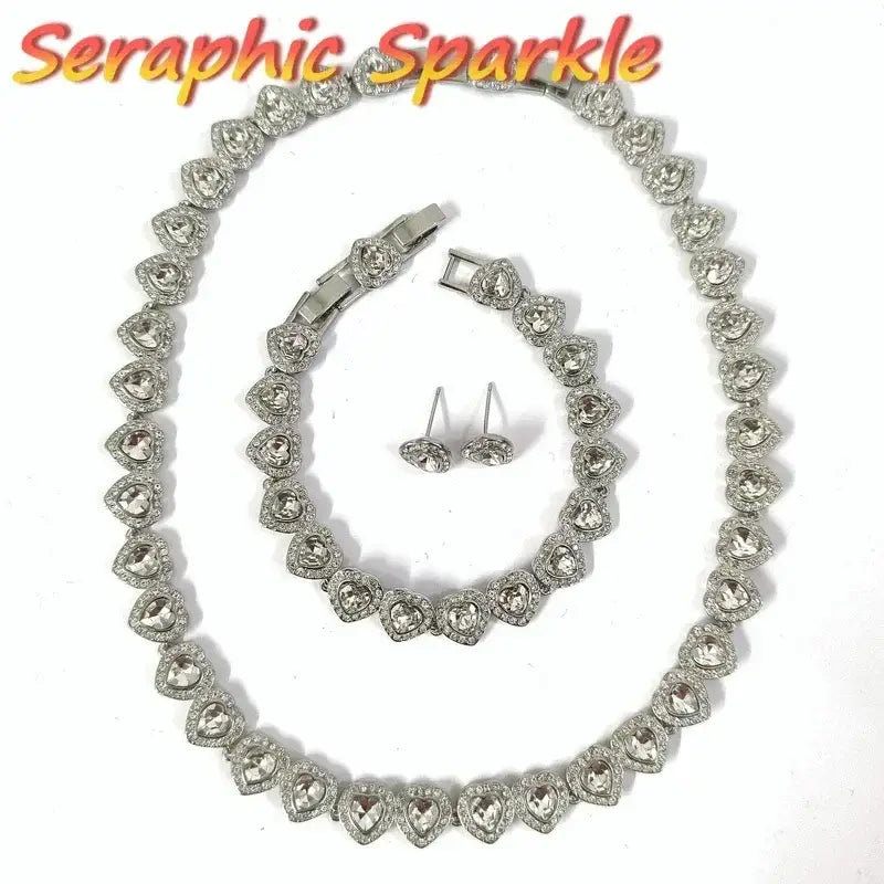 Silver heart-shaped sterling silver tennis necklace set with matching rhinestone bracelet and stud earrings