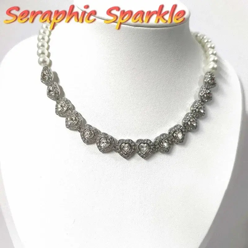 A sparkling sterling silver anime tennis necklace with heart-shaped crystals and white pearl accents on the sides
