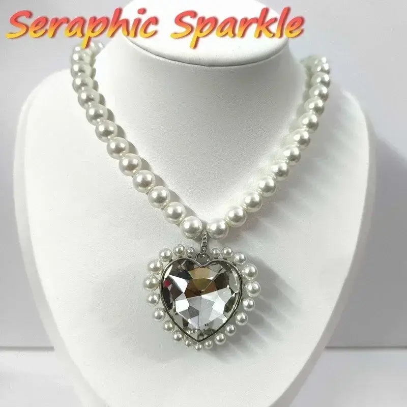 A sterling silver anime tennis necklace with a sparkling heart pendant, faceted crystal center, and pearl chain
