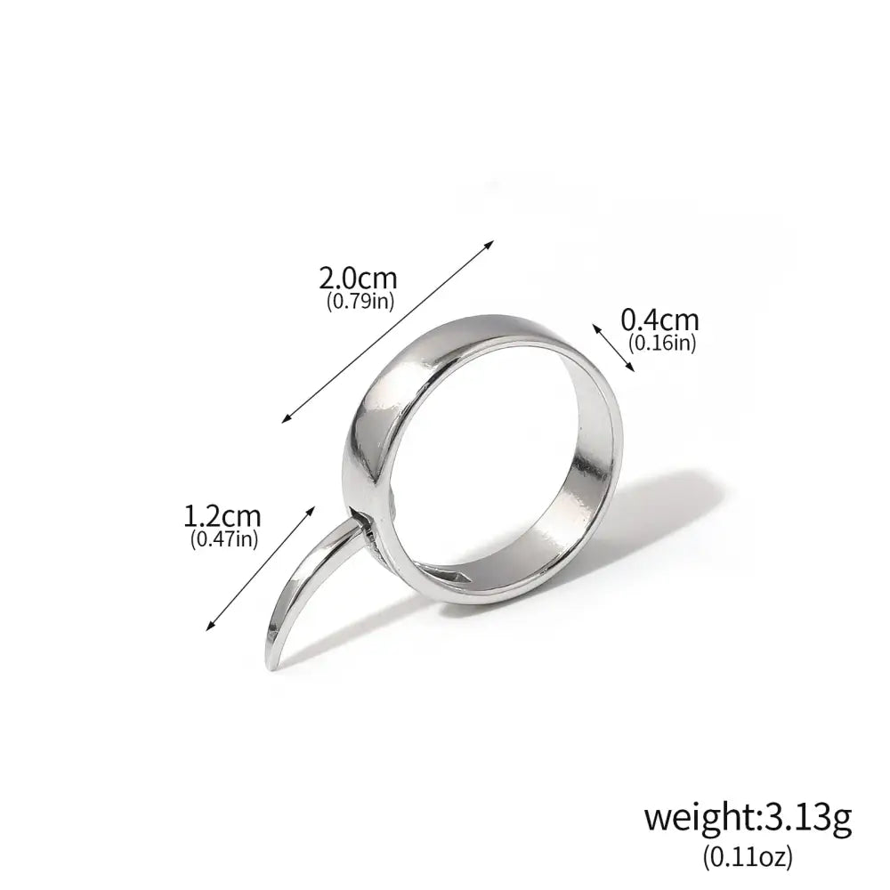 A sleek minimalist silver annie leonhart ring with a smooth polished finish and elegant curved transformation design