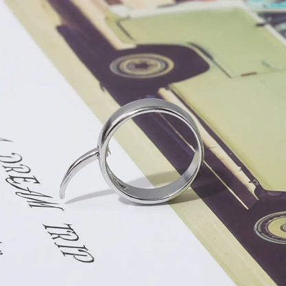 Silver-toned minimalist annie leonhart ring with sleek double-band design and slender prong for transformation style