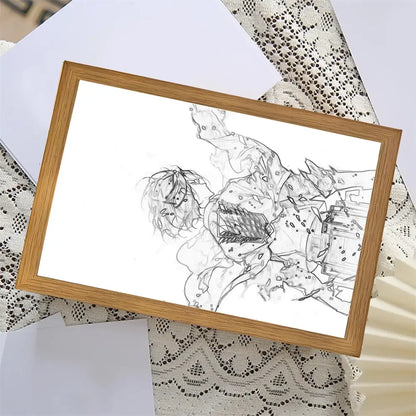 A framed black and white anime sketch in a light wood frame featured in the attack on titan moon lamp decor