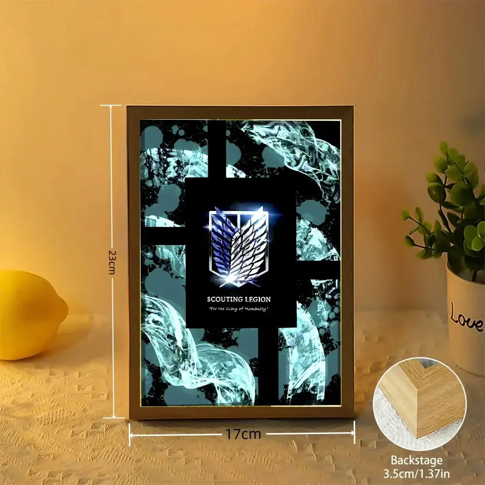 A rectangular wooden-framed led moon lamp frame with a glowing blue and black scout regiment emblem from attack on titan