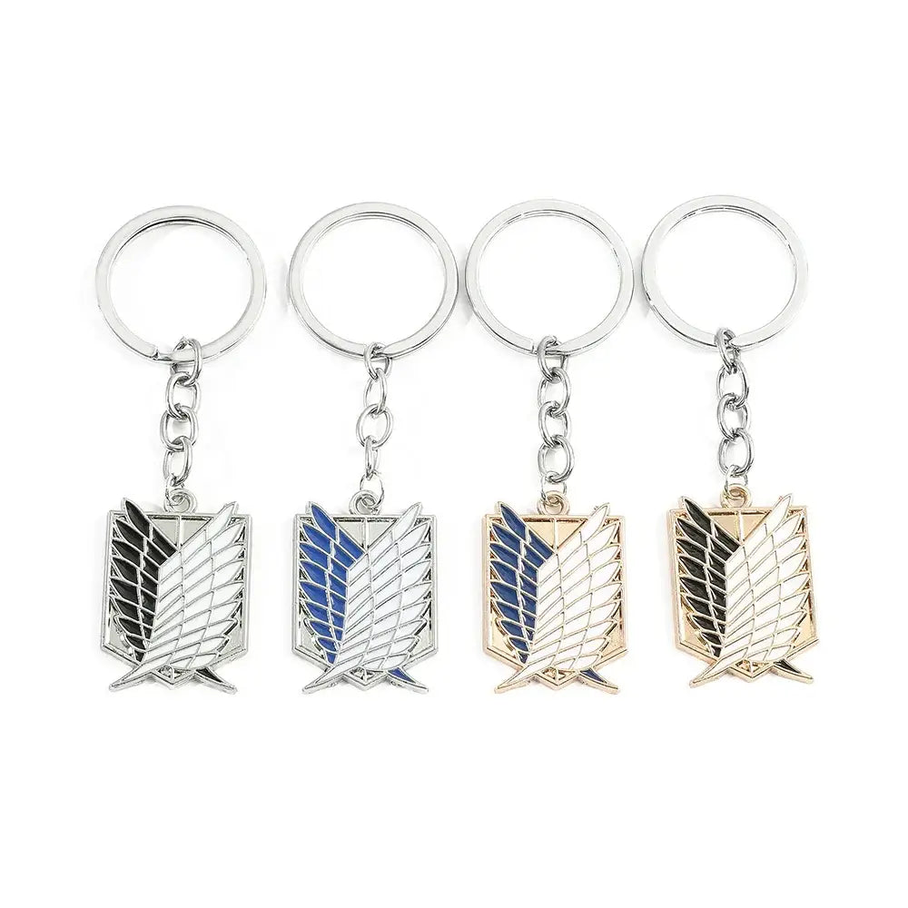Four metallic scout regiment enamel pin keychains in different colors featuring attack on titan emblem