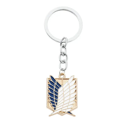 Silver and gold enamel pin keychain featuring attack on titan scout regiment emblem for fans and collectors