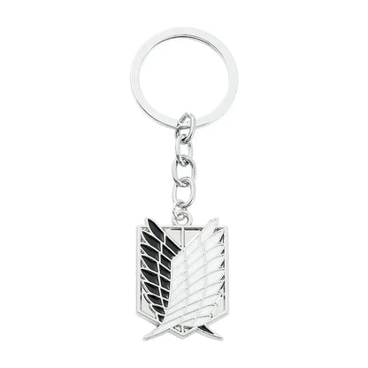 Silver metal scout regiment enamel pin keychain with black and white enamel detailing from attack on titan