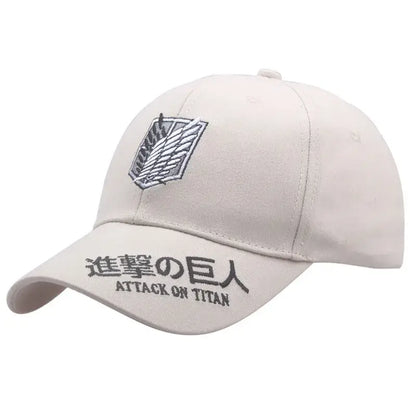 Beige baseball hat featuring embroidered attack on titan titan wings logo and text in japanese and english