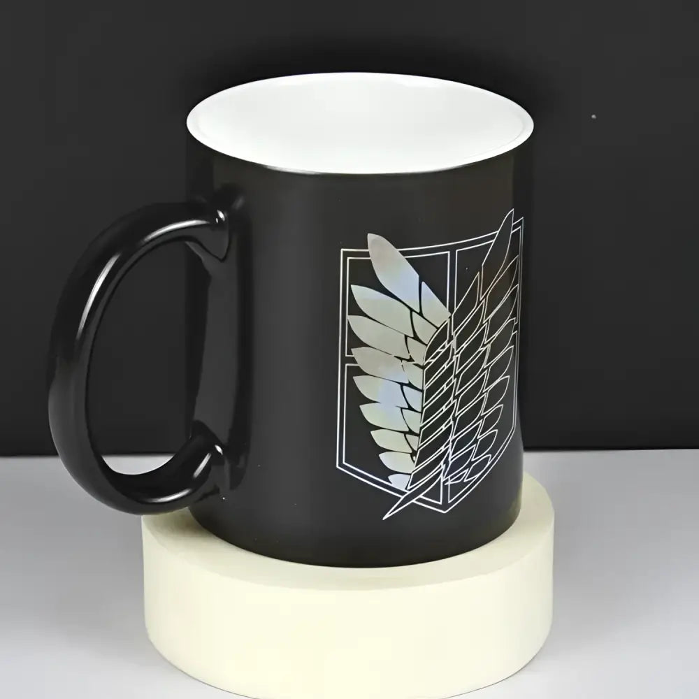 Black ceramic color change mug featuring attack on titan survey corps emblem with iridescent wings details