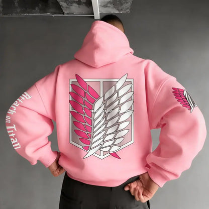 Back view of a pink oversized unisex hoodie with a large attack on titan wings emblem and matching sleeve patches
