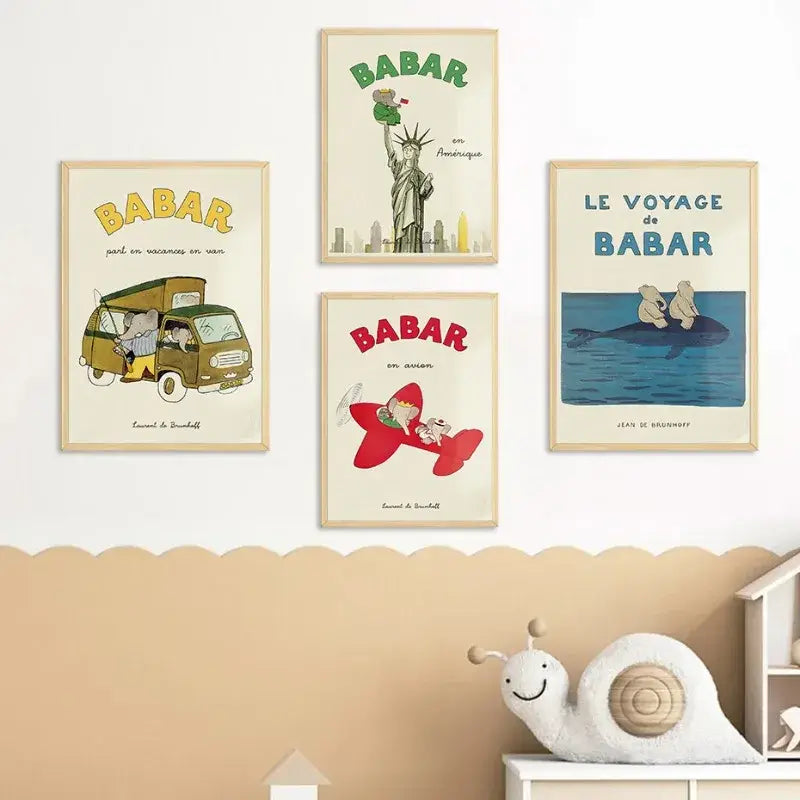 Set of four framed babar elephant family vintage style children’s book posters in light wood frames for nursery decor
