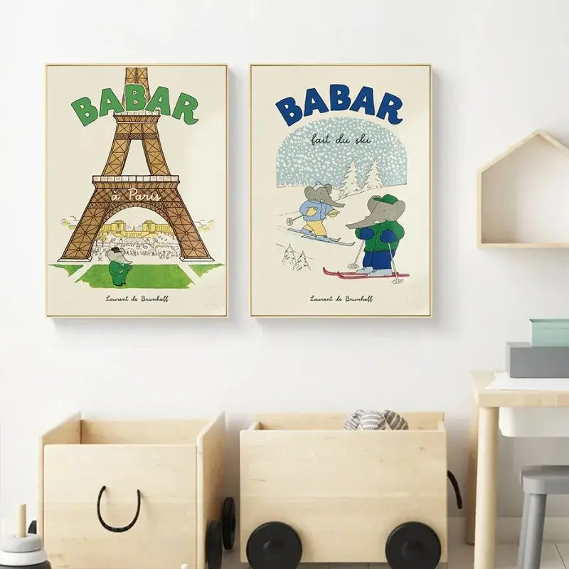 Two framed babar elephant family canvas art posters featuring paris and skiing nursery wall decor in green and blue tones