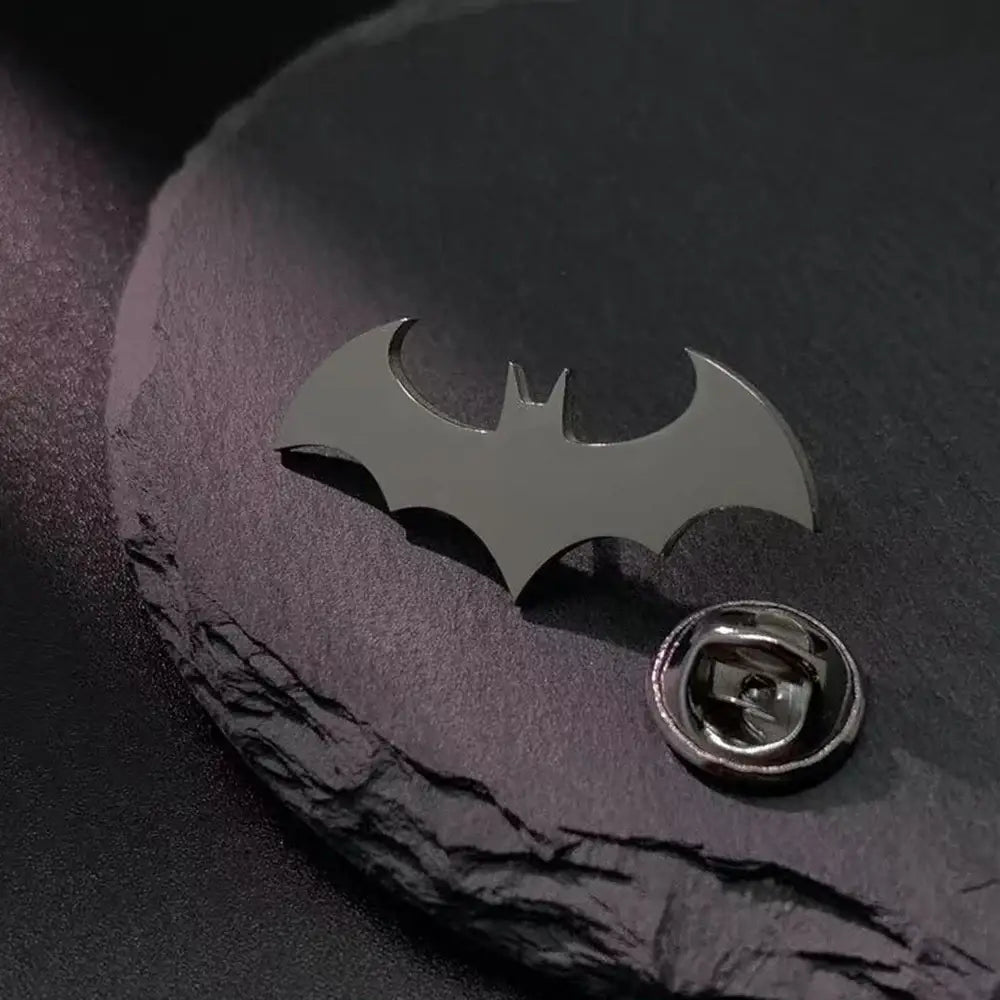 Shiny metallic stainless steel batman symbol lapel pin with classic symbol design and enamel finish