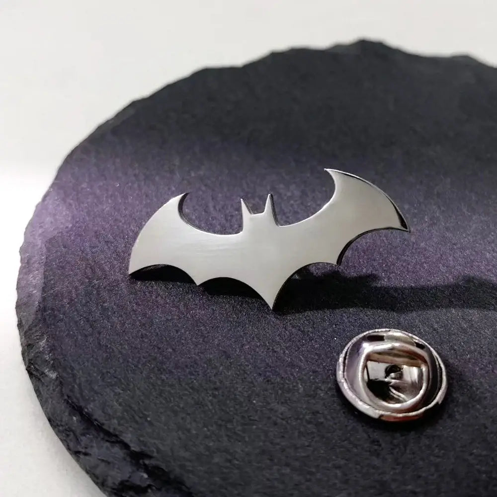 Silver stainless steel batman symbol lapel pin with sleek metallic finish and classic batman silhouette design