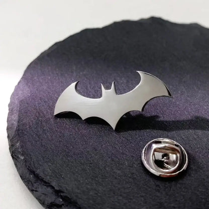 Silver stainless steel batman symbol lapel pin with sleek metallic finish and classic batman silhouette design