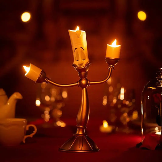 Golden candelabra lumia candle holder with three lit candles and smiling face on central lumia candle anime decor