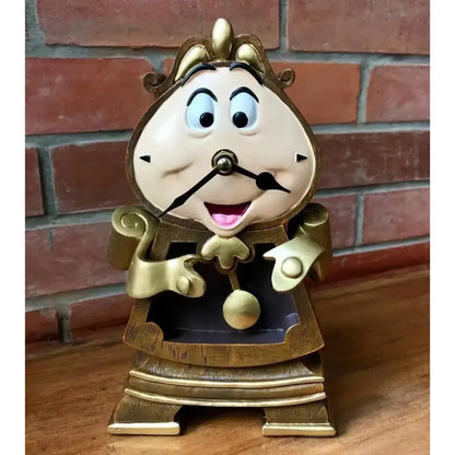 Golden beauty and the beast cogsworth clock figure with ornate design and cheerful face, ideal for lumia candle decor