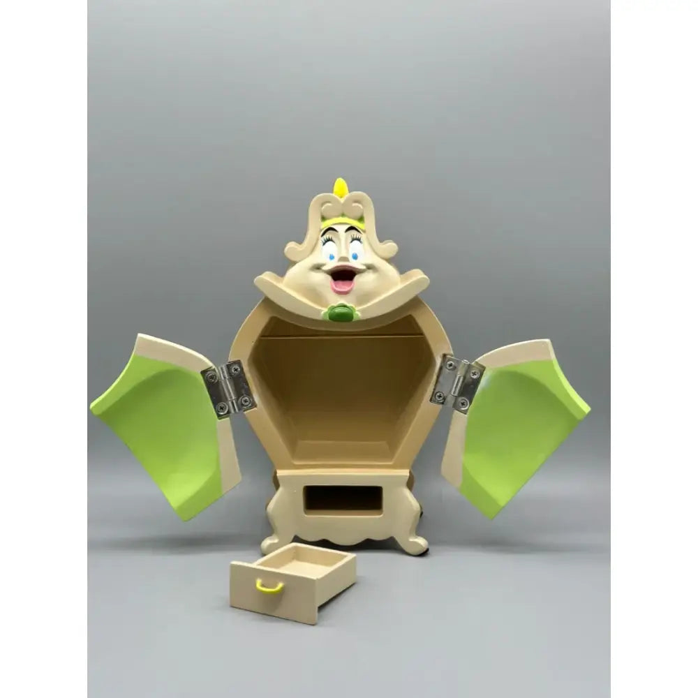 Beige and lime green cogsworth dresser with smiling face and silver hinges inspired by beauty and the beast anime decor