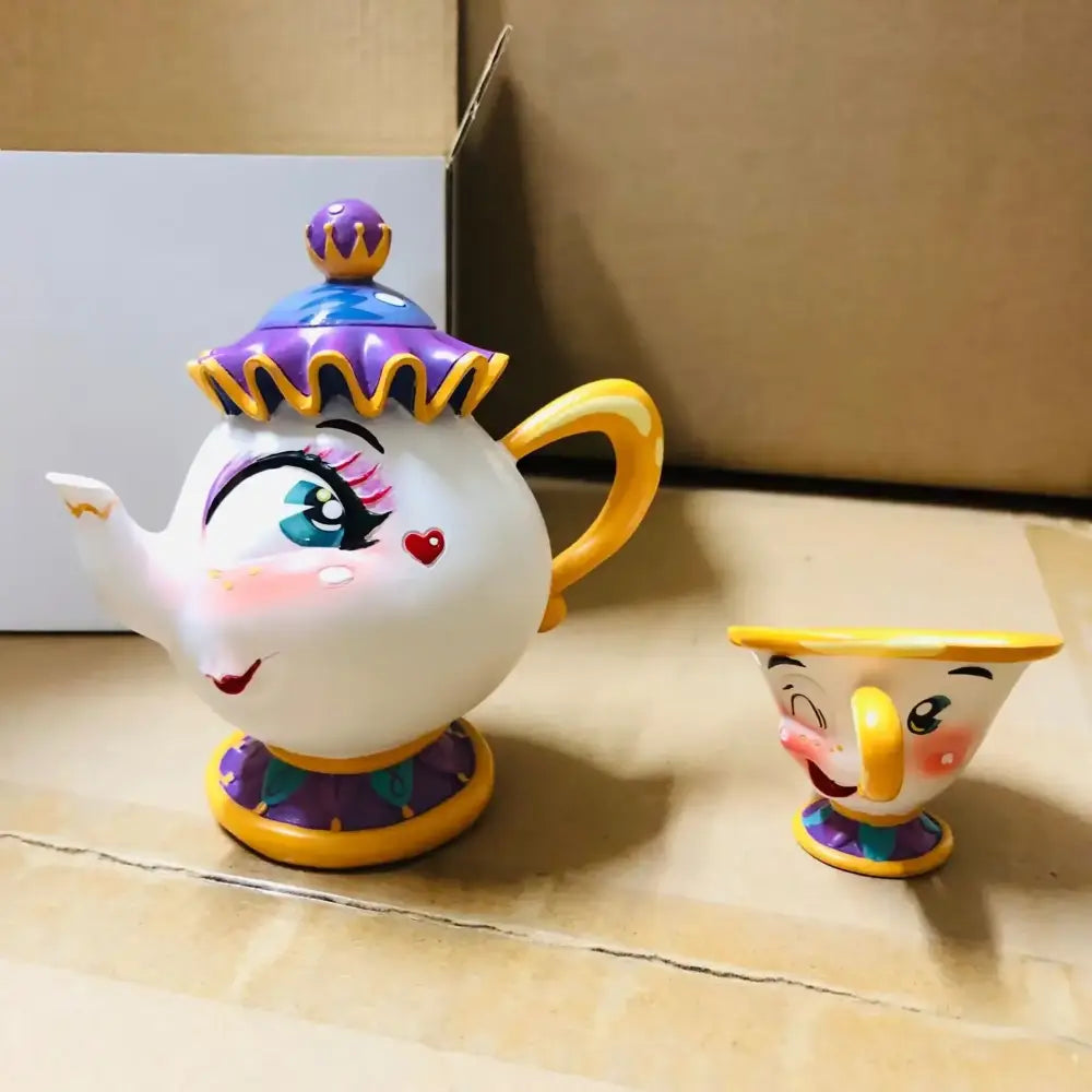 Beauty and the beast cogsworth clock figure ceramic teapot and cup with whimsical face design candle holder accents