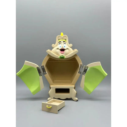Beige and lime green beast cogsworth clock jewelry box dresser with smiling face decorative crown and silver hinges