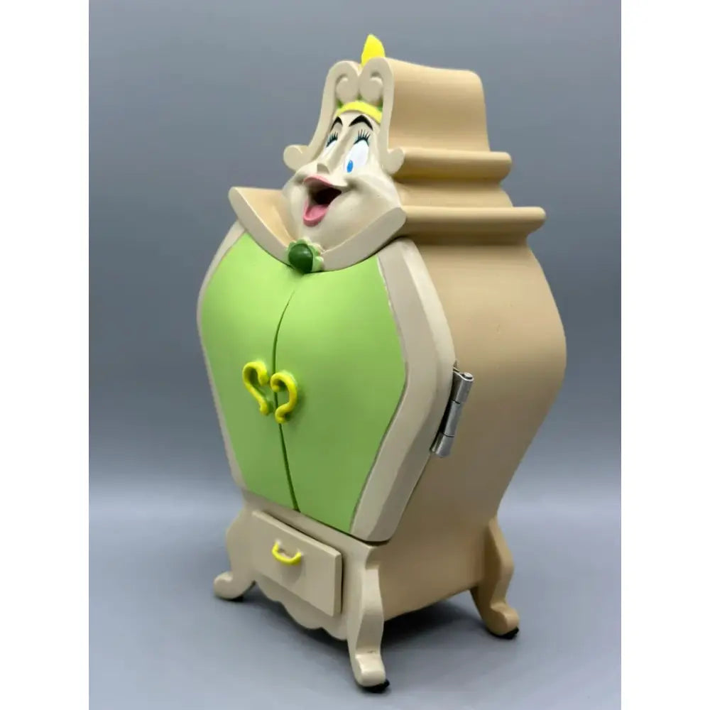 Beauty and the beast cogsworth clock jewelry box shaped like a whimsical beige and lime green lady figurine with heart handles
