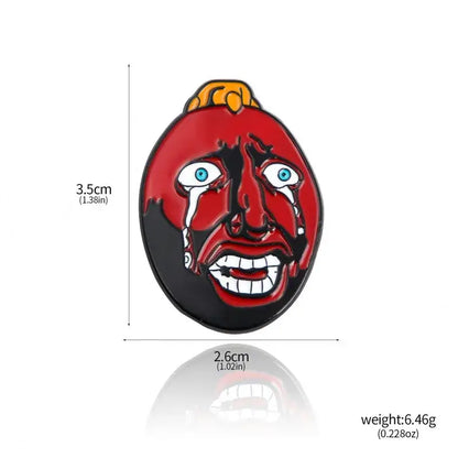 Red and black enamel behelit pendant necklace with cartoonish face tears blue eyes white teeth zinc alloy