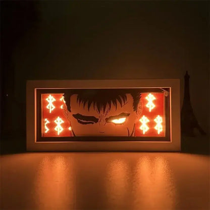 A glowing paper carved berserk guts and griffith led lamp with intense eyes and 16-color remote control lights