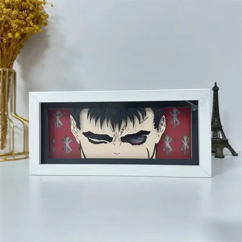 White framed berserk guts griffith paper-cut 3d led light box featuring anime character with black hair and red background
