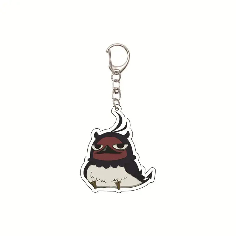 Black clover asta acrylic keychain featuring a cute black and white cartoon bird with red eyes and silver clasp