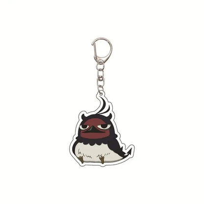 Black clover asta acrylic keychain featuring a cute black and white cartoon bird with red eyes and silver clasp