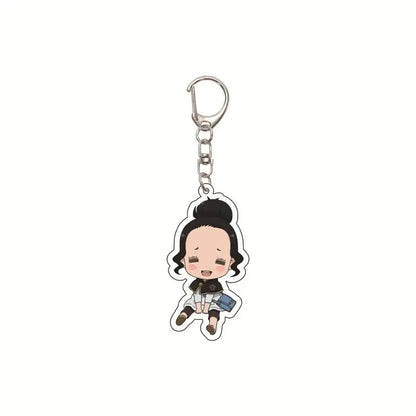 A clear acrylic black clover asta keychain with chibi character holding a blue bag for bag pendant use