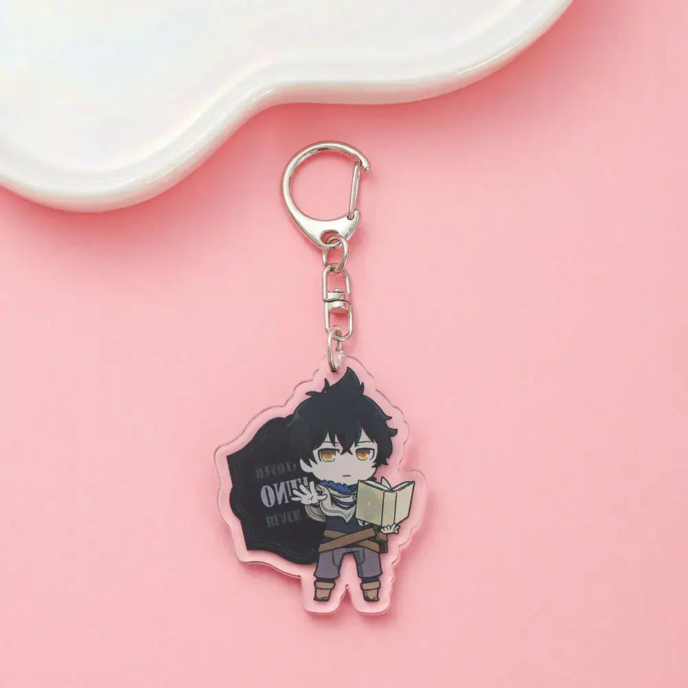 Pink acrylic black clover asta keychain featuring chibi anime character holding book for cute backpack charm