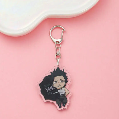 Clear acrylic black clover asta keychain featuring chibi black hair character holding yam bag cute backpack charm